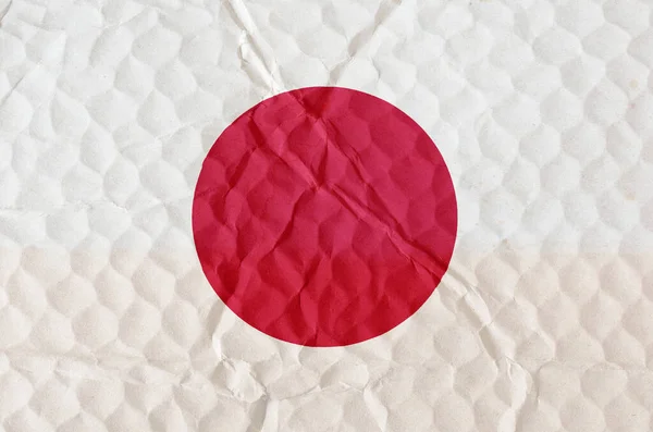 凹凸のある表面に日本の国旗 太陽が昇る国の白と赤の旗 独立国家の概念 — ストック写真