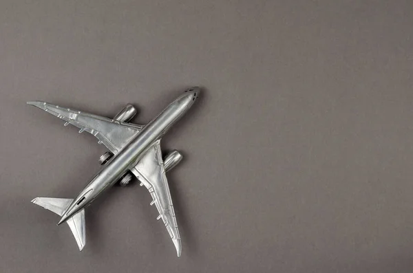 Minimalist Composition Silver Children Toy Airplane Gray Background Top View — Stock Photo, Image