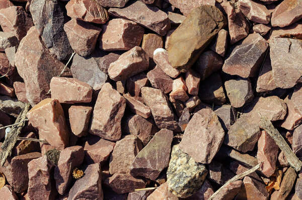 Crimson Quartzite. Chipped rubble stone. Random pieces of red stones used in interior, exterior, landscape design.