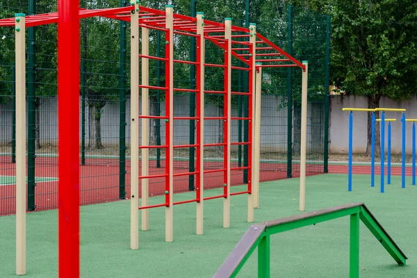 Sports ground with a variety of horizontal bars. Open area for s