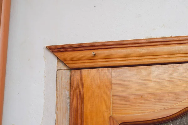 Installing the door trim inside the room. Wooden door with parti — 스톡 사진