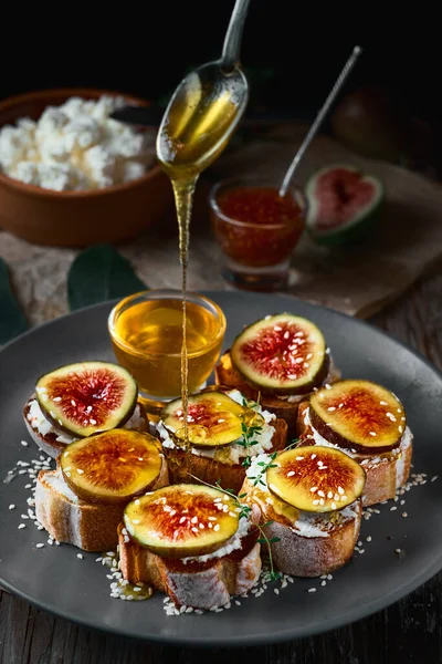 Honey Dripping Spoon Fig Sandwiches Toasted Goat Cheese Baguette Plate — Stock Photo, Image