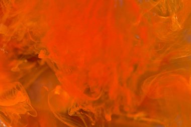 Suda çözünen renkli turuncu mürekkep. Soyut turuncu boya arkaplanı