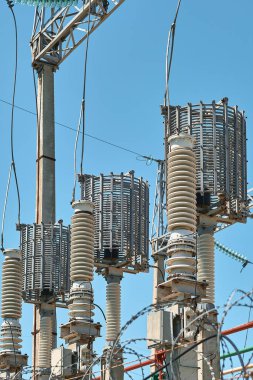 High voltage electrical transformers in an electricity distribution power plant. Close-up