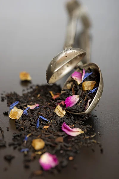 Herbal tea and silver strainer — Stok fotoğraf