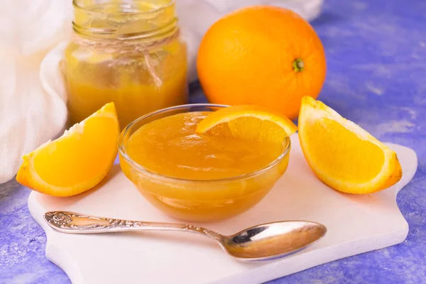 Organic Orange Jam Glass Bowl Blue Background Close — Stock Photo, Image