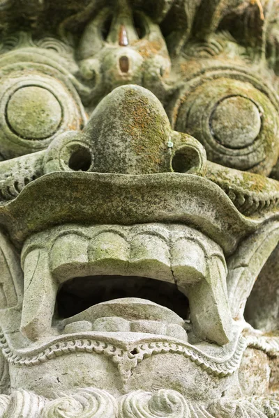 Dragon sculpture on the bridge in monkey forest, Ubud, Bali. — Stock Photo, Image