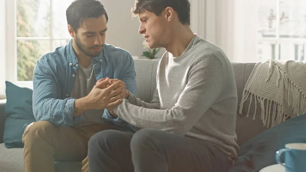 Sad Queer Drama Concept. Boyfriend is Unhappy and Depressed About Something. His Gay Friend is Comforting Him, Holding His Hands. They Holds Each other Hands.