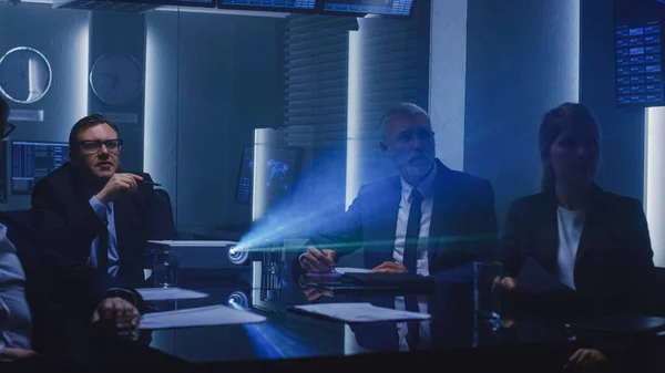 Government Officials, Military Men and Top Corporate Executives Watching Presentation in the Conference Room. Working Projector on the Table. — Stock Photo, Image