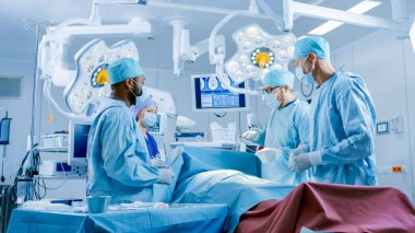 Diverse Team of Professional Surgeons Performing Invasive Surgery on a Patient in the Hospital Operating Room. Surgeons Use Instruments. clipart