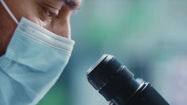 Macro Footage Scientist Using Microscope in Laboratory — 비디오