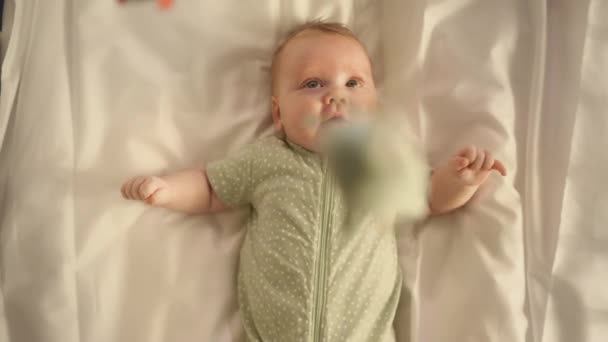 Newborn Excited about Hanging Crib Toys — Stock Video