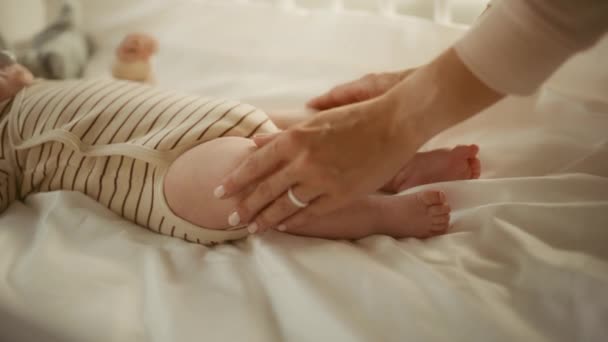 Mother Soothing Baby in Crib — Stock Video