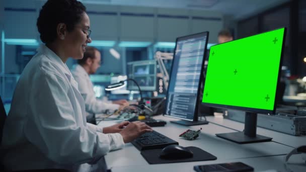 Electronics Development Facility Scientist Working on Green Screen Computer — Stock Video