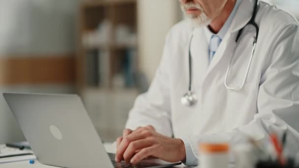 Doctor in Office uses Laptop Computer — Stock Video