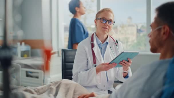 Hospital Ward Doctor Using Tablet Computer and Patient in Bed — Stock Video