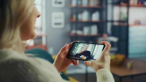 Female on Video Call on Smartphone in Living Room — Stock Video