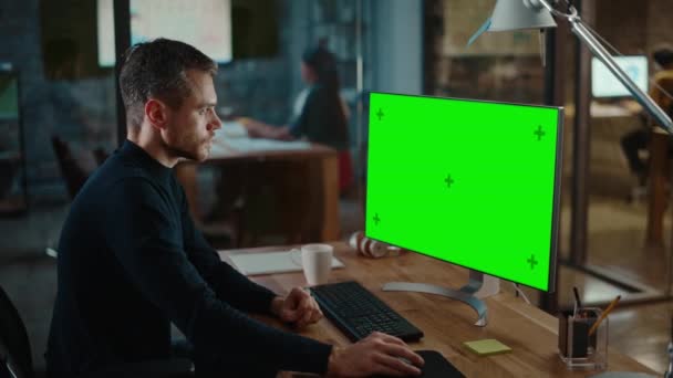 Human Works on Computer with Green Screen in Creative Office — 비디오