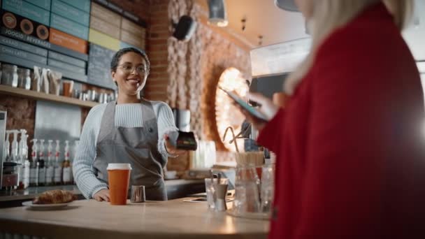 Client Pays for Coffee with NFC Mobile Payment — Stock Video