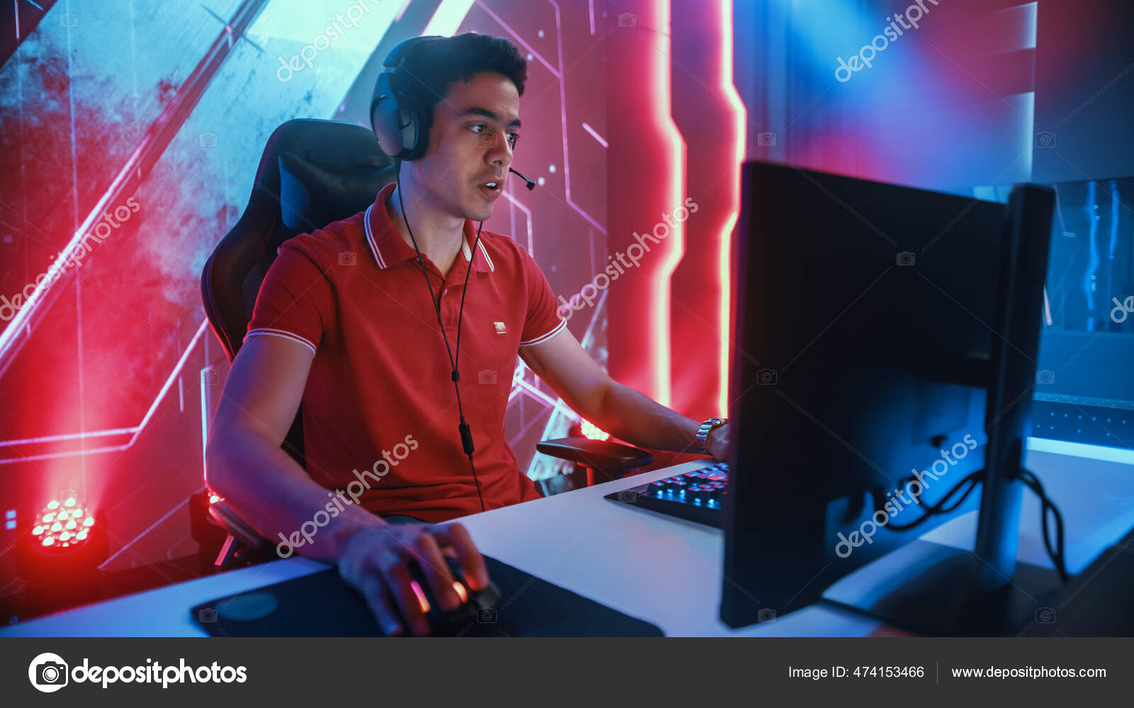 Professional eSports Gamer Playing in Computer Video Games. In Background Stylish Graphics