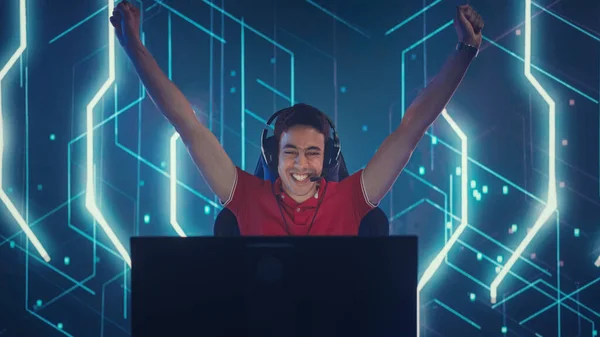 Professional eSports Gamer Playing in Computer Video Games, Happily and Cheerfully Celebrates Victory and Success with Raised Hands. Online Cyber Championship Tournament. Portrait View — Stockfoto
