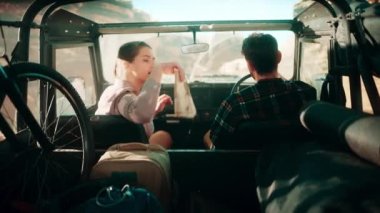 Travelers Riding in Car Desert