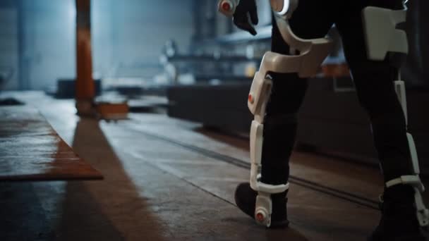 Industrial Factory Worker Walking While Wearing Exoskeleton — Stock video