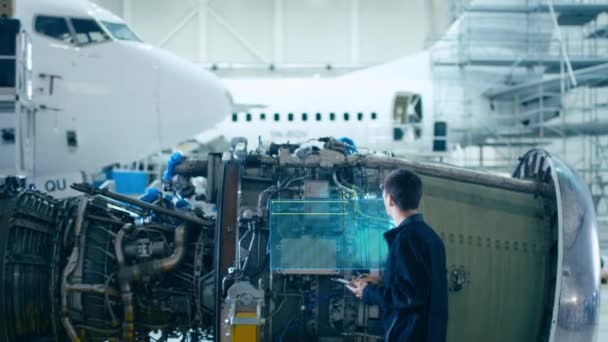 VFX Airplane Mechanic does Digital maintenance of Engine — Stock Video