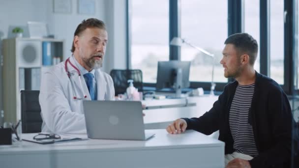 Medical Doctor Talks to Patient in Hospital Office — Stock Video