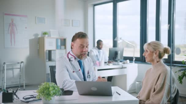 Medical Doctor Talks to Patient in Hospital Office — Stock Video