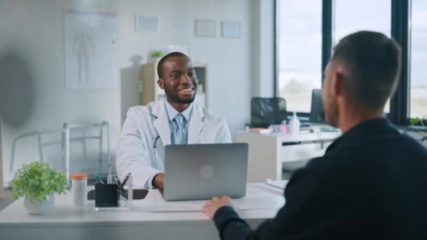 Medical Doctor Talks to Patient in Hospital Office — Stock Video