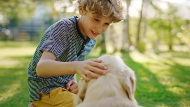 Boy Pets Golden Retriever Dog — Stock Video