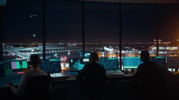 Air Traffic Control Team Works in Airport Tower at Night — Stock Video