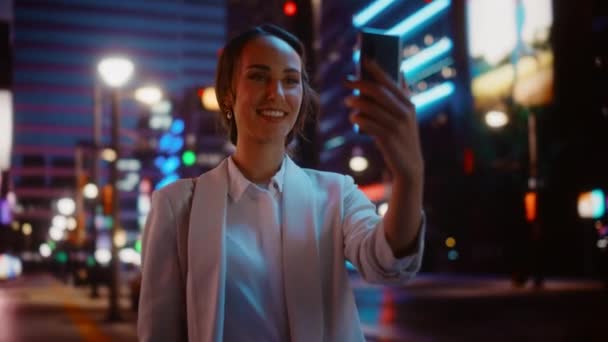 Woman Using Smartphone in Night City — Stock Video