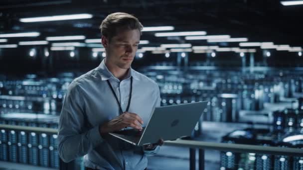 Data Center Specialist Uses Laptop Computer — Stock Video