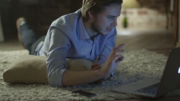 Young Man using Laptop for Video Call at Home in Evening Time. Casual Lifestyle. — Αρχείο Βίντεο