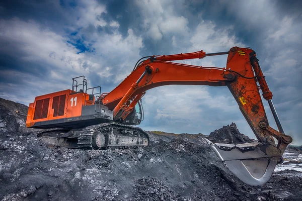 Big orange excavator at worksite — Stock Photo, Image