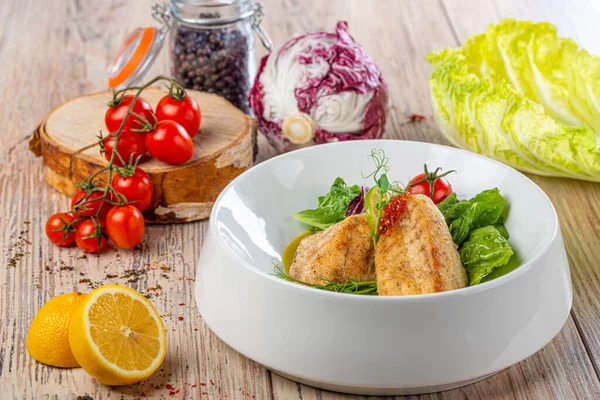 Plate with grilled salmon fillets and salad leaves with vegetables on wooden background, close view — Stock Image Plate Grilled Salmon Fillets Salad Leaves Vegetables Wooden Background Close Royalty Free Stock Images