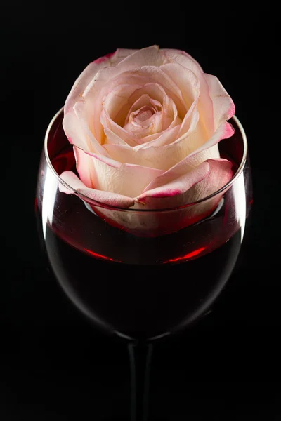 Rose in glass of wine — Stock Photo, Image
