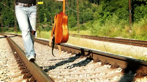 Teenager balancing on the railways — Stock Video