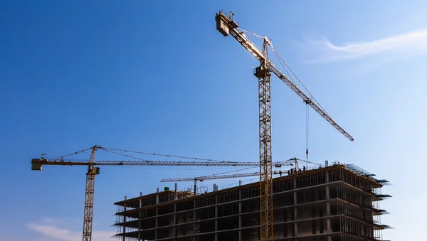 Building cranes on construction Royalty Free Stock Photos