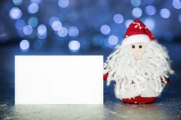 Santa Claus of Vadertje Vorst met witte lege kaart Stockfoto