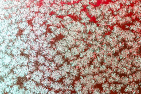 Snowflakes on frozen window — Stock Photo, Image