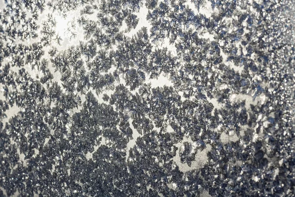 Snowflakes and ice on frozen window — Stock Photo, Image