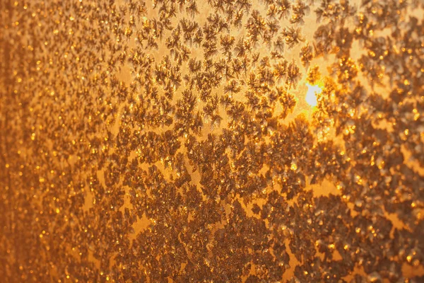 Snowflakes and ice on frozen window — Stock Photo, Image