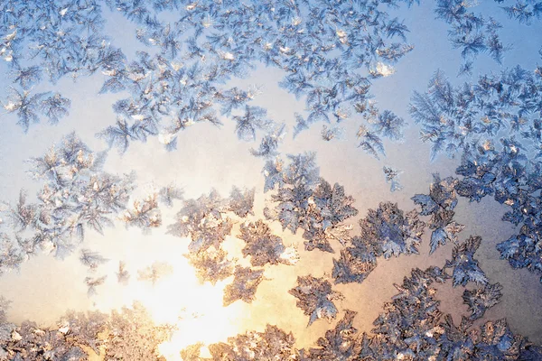 Frost and snowflakes on frozen window — Stock Photo, Image