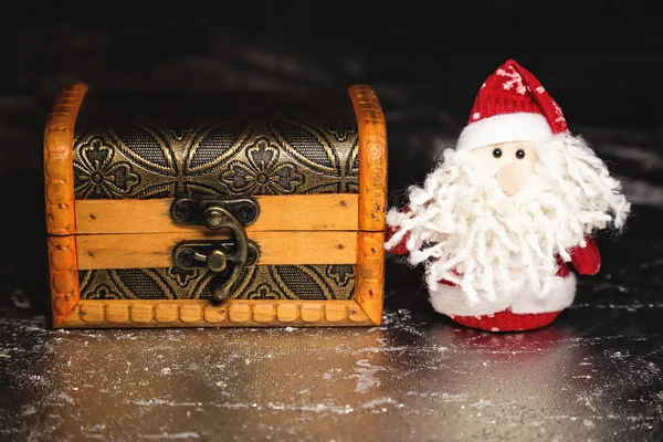 Santa Claus with wooden chest — Stock Photo, Image