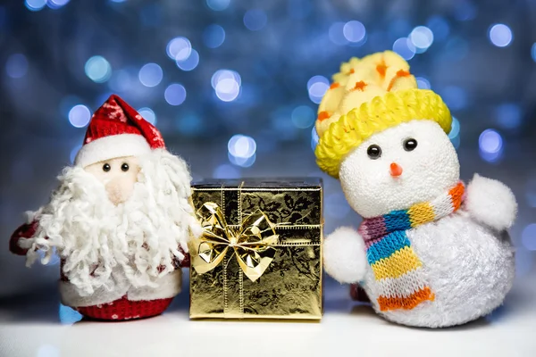 Santa Claus and Snowman with gift box — Stock Photo, Image