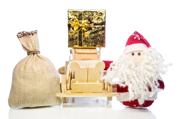 Santa Claus with wooden car, gift box and sack — Stock Photo, Image