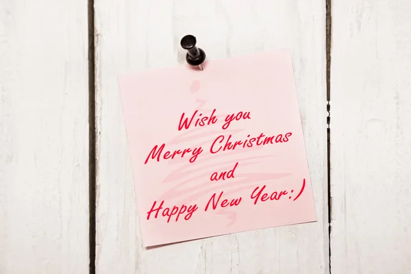 Christmas greeting note paper with pin — Stock Photo, Image